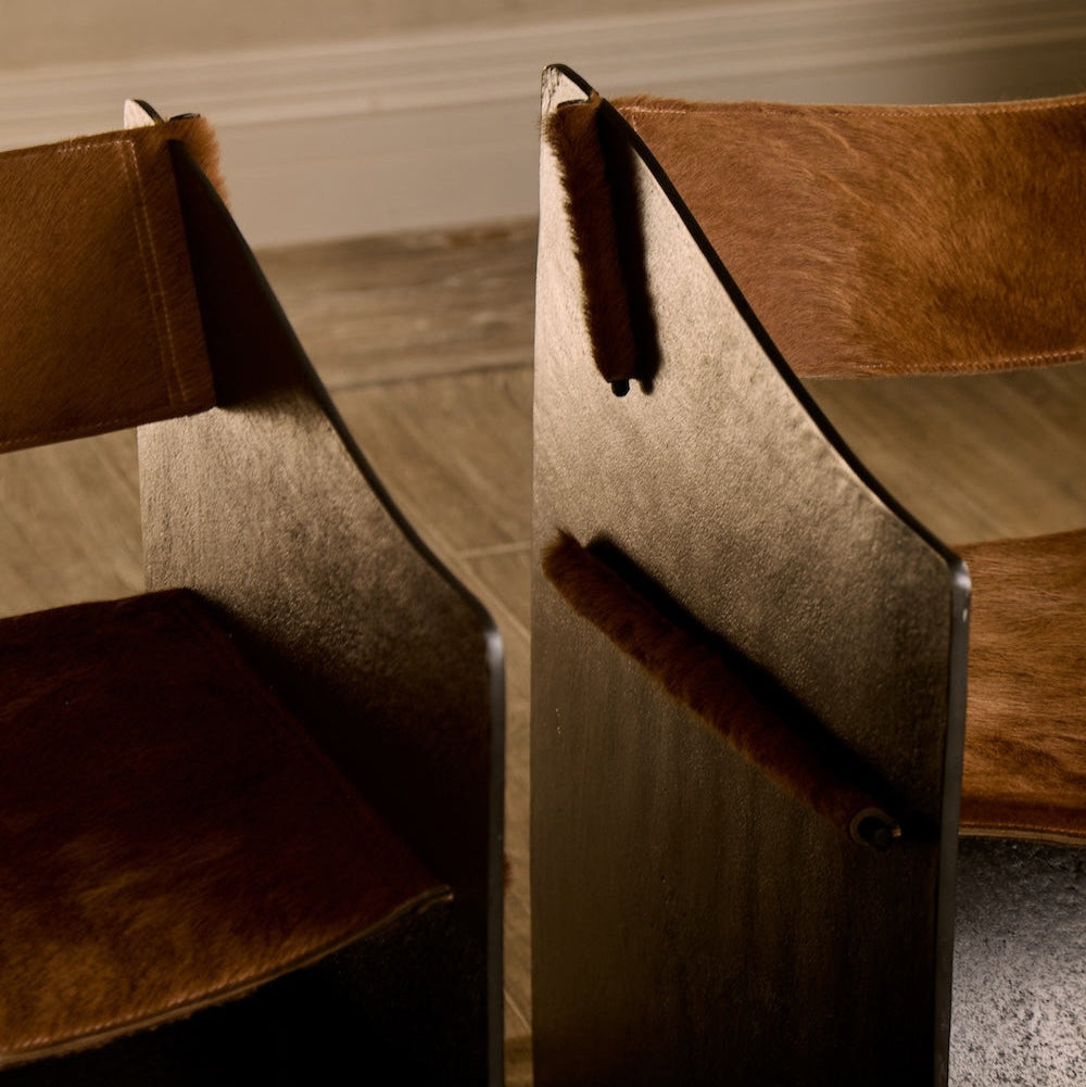 https://cdn.shopify.com/s/files/1/0593/2217/1565/files/brutalist-ingresso-accent-chair-whiskey-hair-on-hide-whiskey-15.jpg?v=1753822707