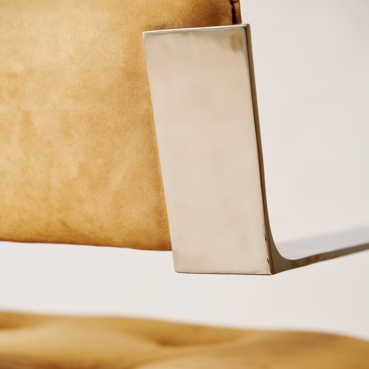 https://cdn.shopify.com/s/files/1/0593/2217/1565/files/camel-chrome-chair-suede-comfortable.jpg?v=1742496747