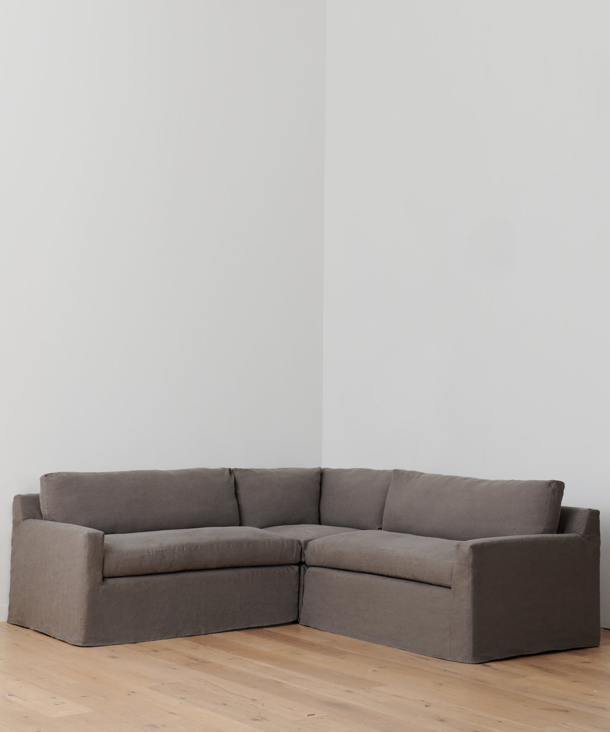 https://cdn.shopify.com/s/files/1/0565/1234/8333/products/linen-harbor-sectional-corner-charcoal-1.jpg?v=1753132212