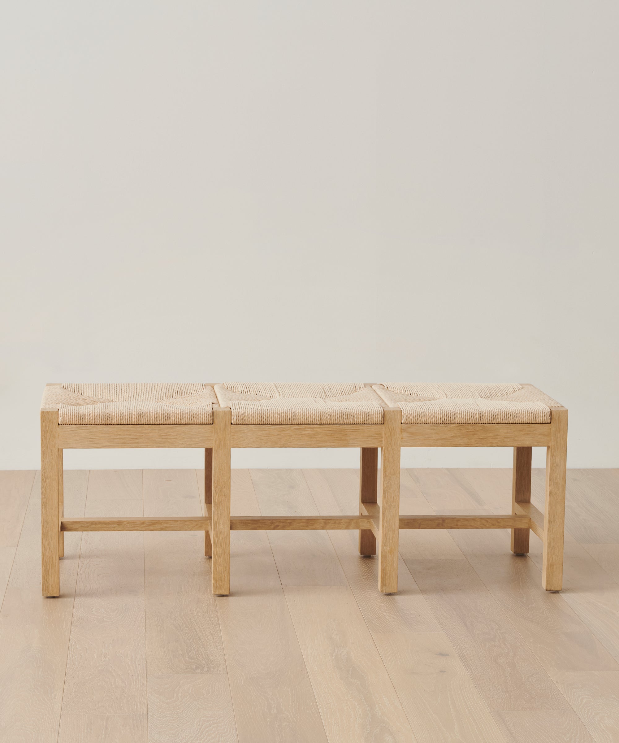 https://cdn.shopify.com/s/files/1/0565/1234/8333/files/oak-handwoven-danish-paper-montecito-bench-oak-01.jpg?v=1762183168