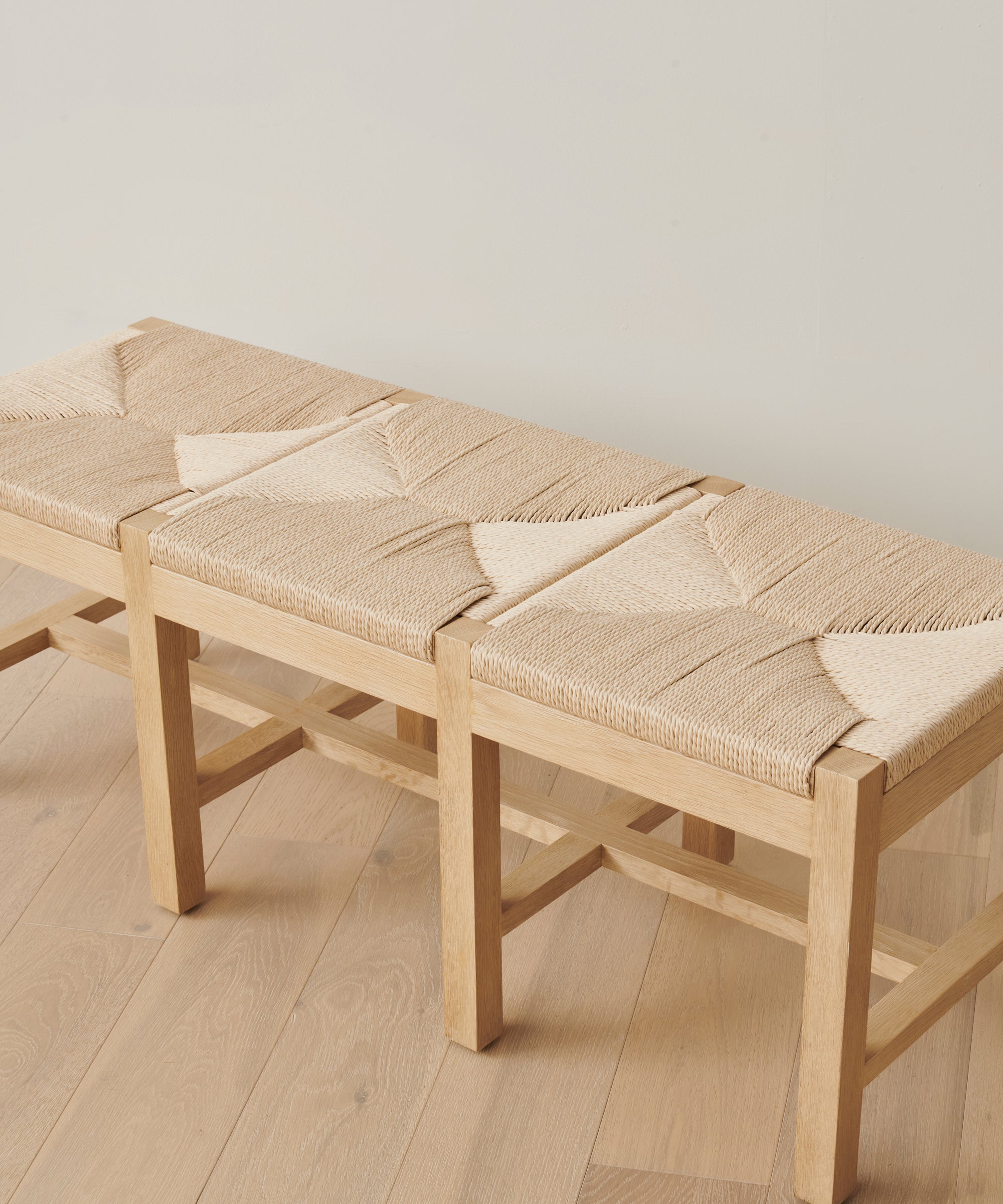 https://cdn.shopify.com/s/files/1/0565/1234/8333/files/oak-handwoven-danish-paper-montecito-bench-oak-02.jpg?v=1682454042