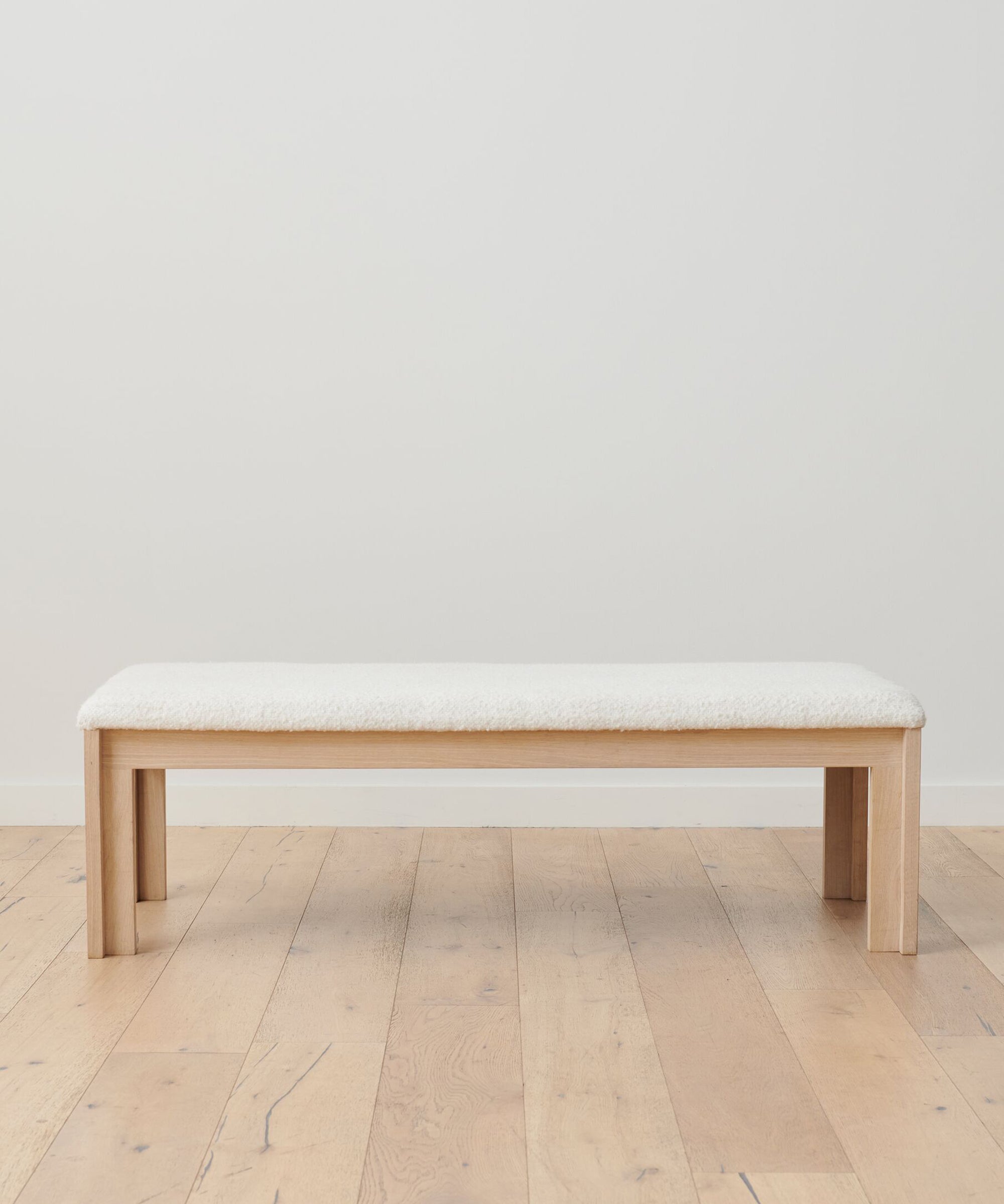 https://cdn.shopify.com/s/files/1/0565/1234/8333/products/otto-upholstered-wood-bench-ivory-wool-boucle-1.jpg?v=1762181960