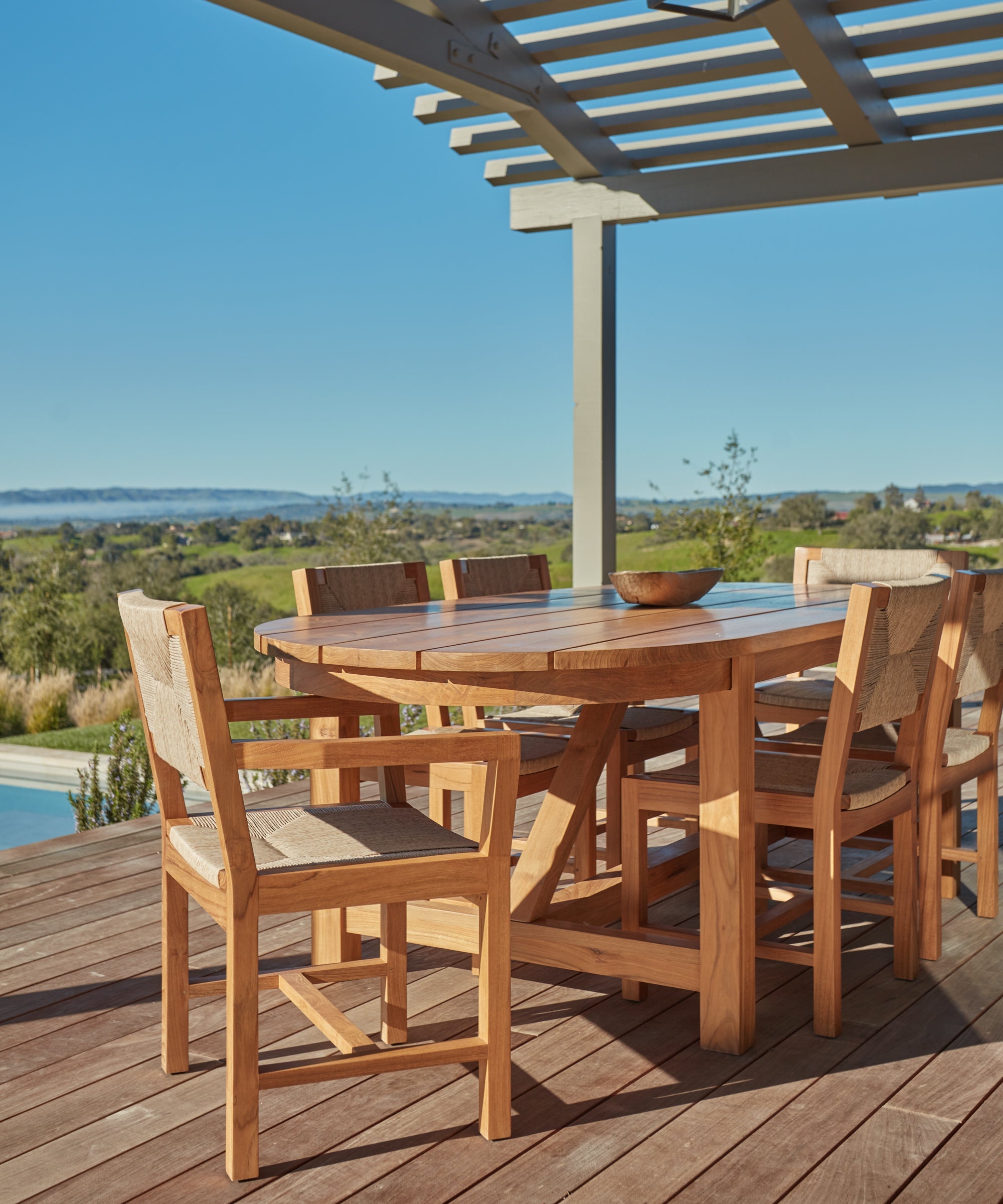 https://cdn.shopify.com/s/files/1/0565/1234/8333/files/outdoor-oval-montecito-dining-table-teak-4.jpg?v=1682458177
