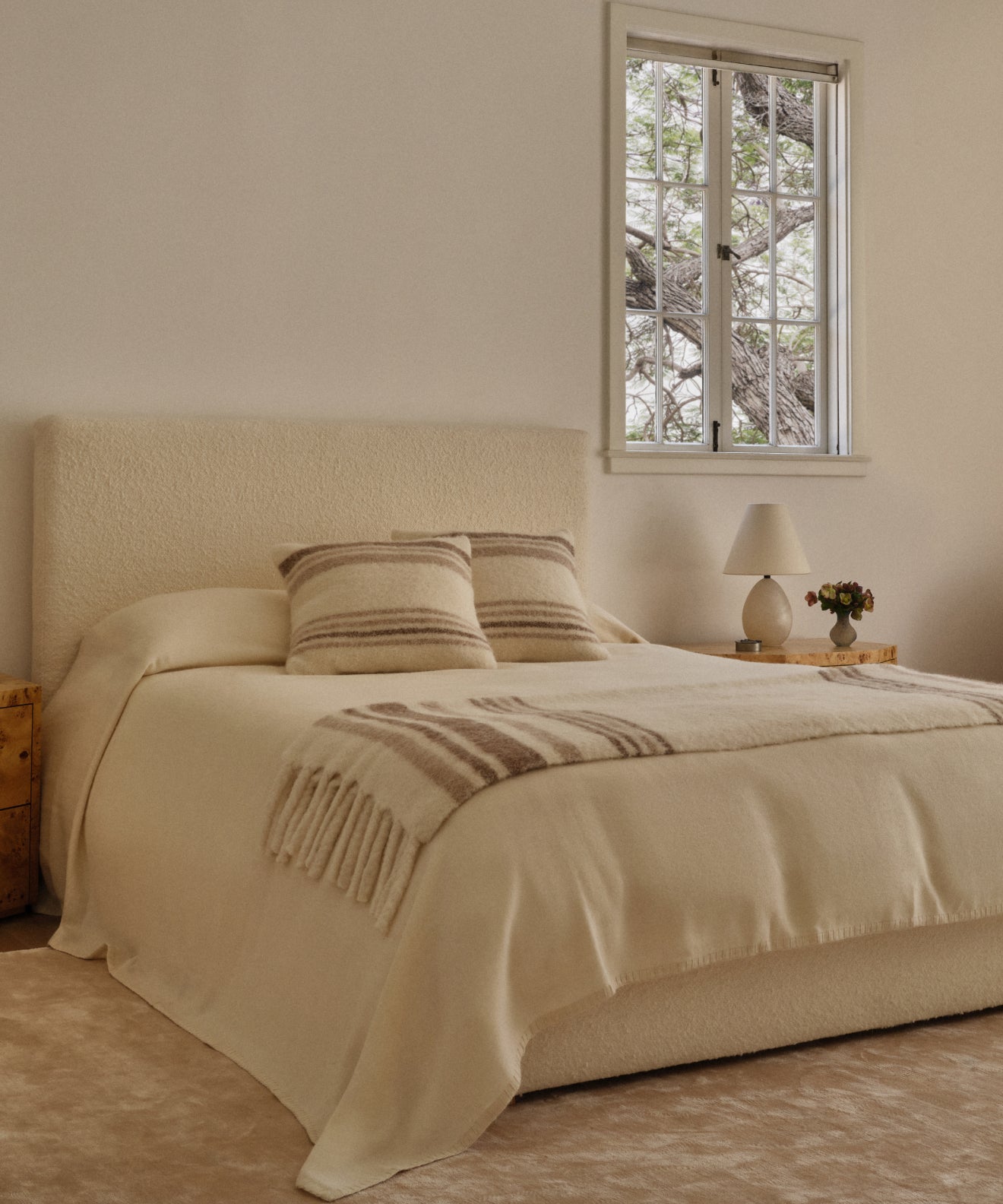https://cdn.shopify.com/s/files/1/0565/1234/8333/files/pacific-bed-ivory-wool-bouclev3-1.jpg?v=1758845327