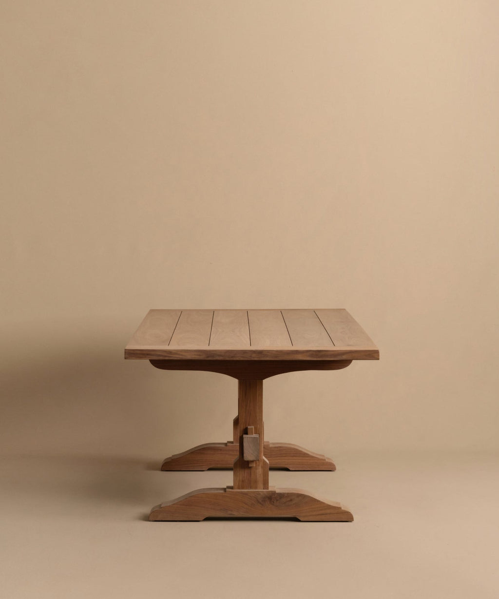 https://cdn.shopify.com/s/files/1/0565/1234/8333/files/trestle-dining-table-walnut-4.jpg?v=1760555104