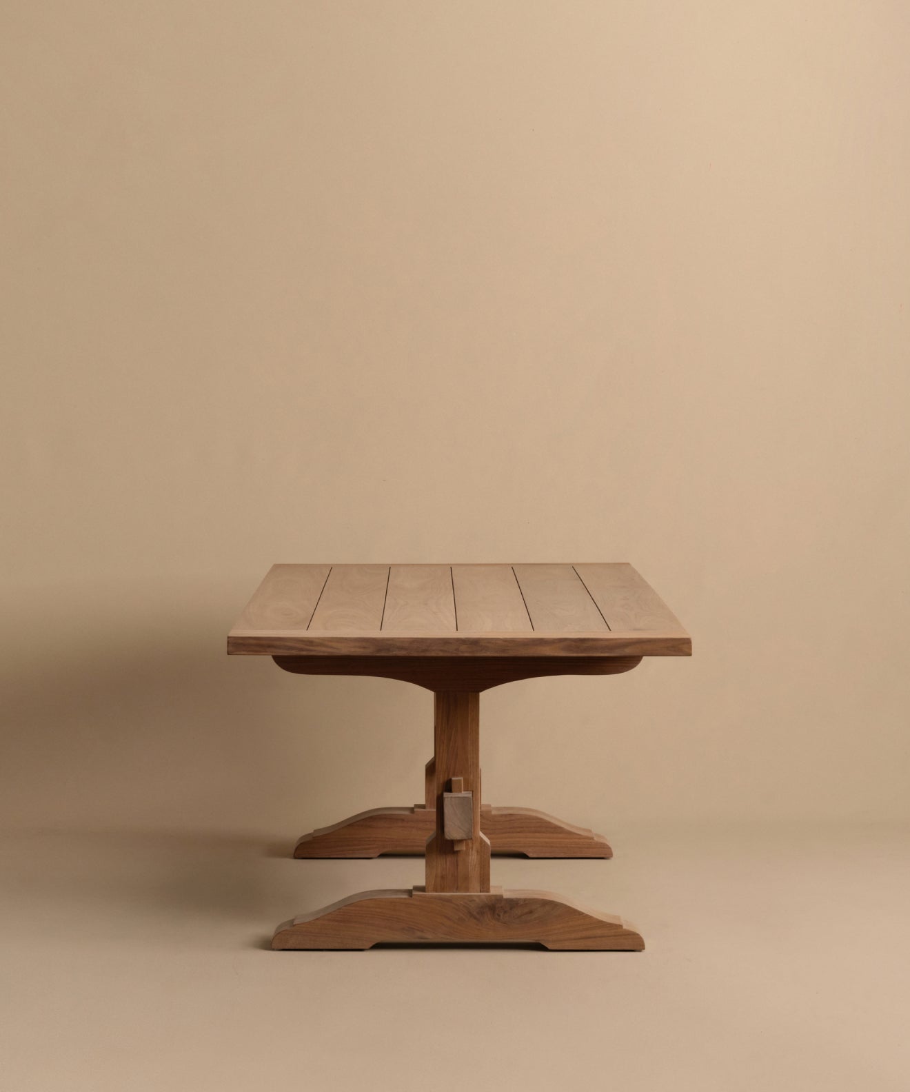 https://cdn.shopify.com/s/files/1/0565/1234/8333/files/trestle-dining-table-walnut-4.jpg?v=1760555104