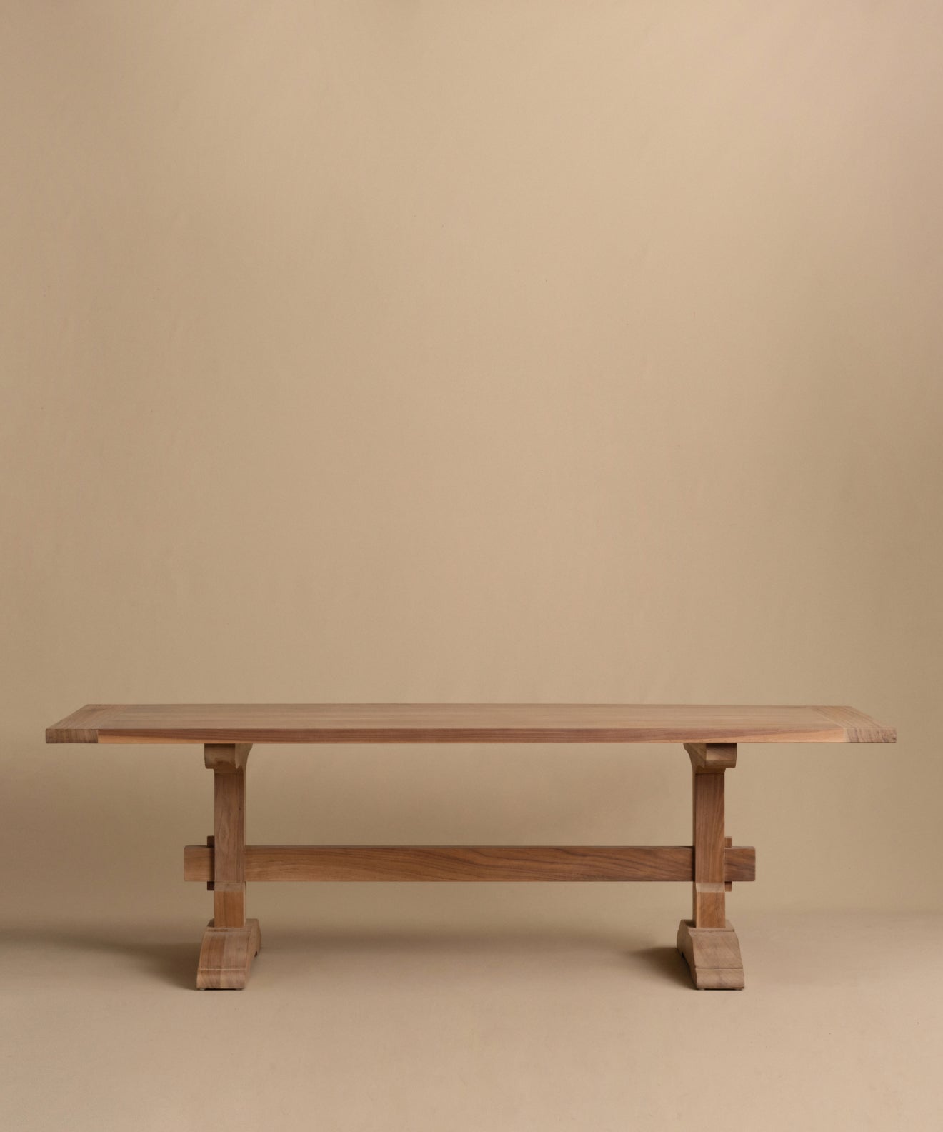https://cdn.shopify.com/s/files/1/0565/1234/8333/files/trestle-dining-table-walnut.jpg?v=1760555094