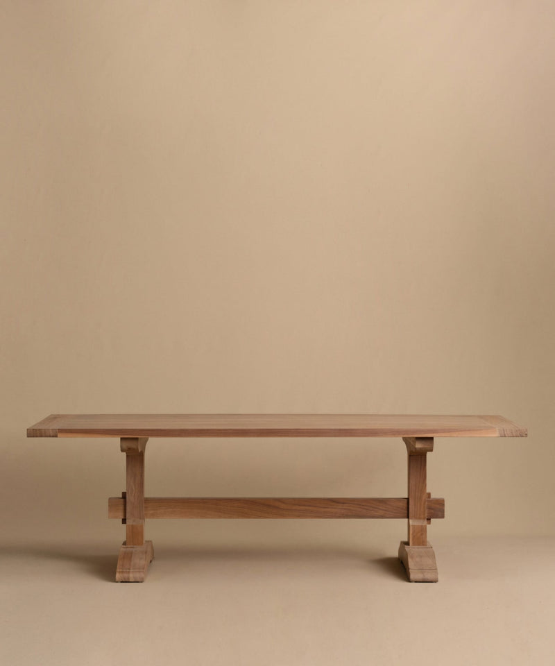 https://cdn.shopify.com/s/files/1/0565/1234/8333/files/trestle-dining-table-walnut.jpg?v=1760555094
