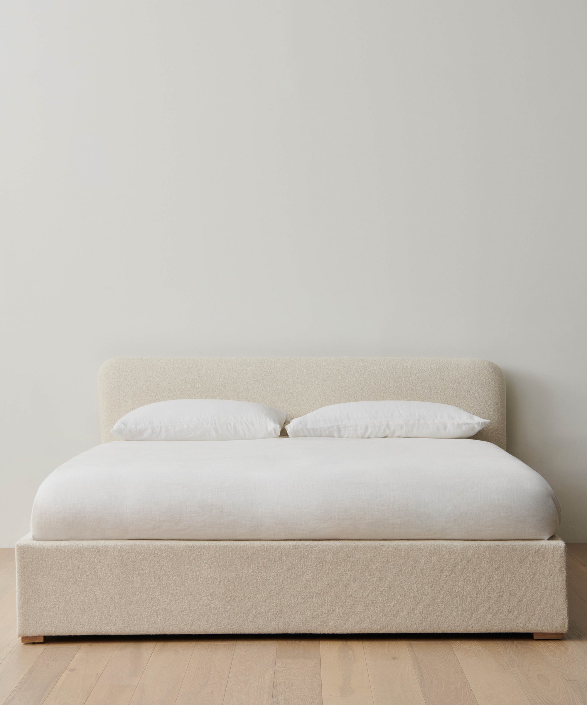 https://cdn.shopify.com/s/files/1/0565/1234/8333/files/upholstered-cove-bed-oyster-mini-boucle-1.jpg?v=1744840917