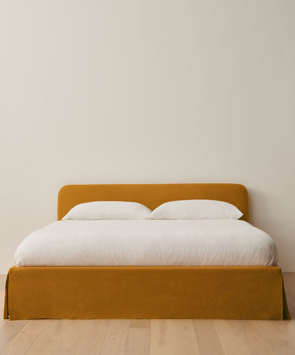 https://cdn.shopify.com/s/files/1/0565/1234/8333/files/upholstered-linen-cove-bed-mustard-linen-01.jpg?v=1744842762