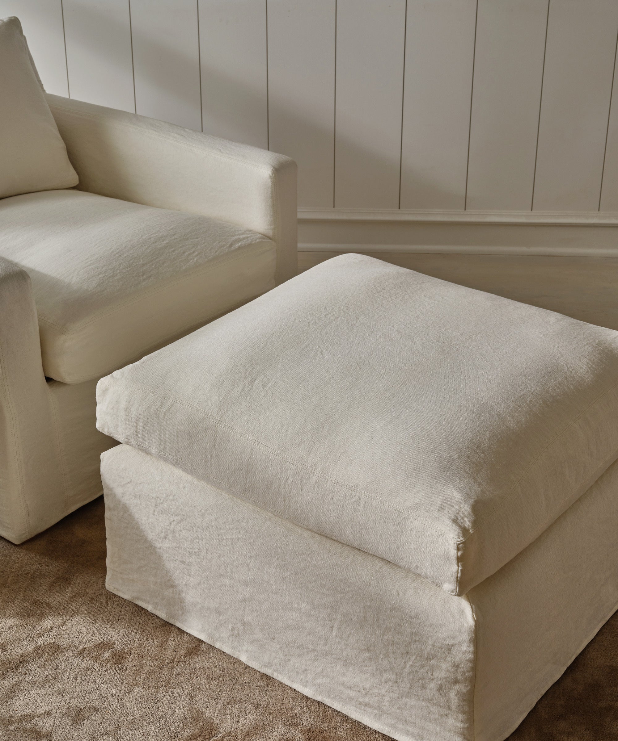 https://cdn.shopify.com/s/files/1/0565/1234/8333/files/upholstered-linen-harbor-ottoman-home-furniture-ivory-linen-v3-2.jpg?v=1706904045