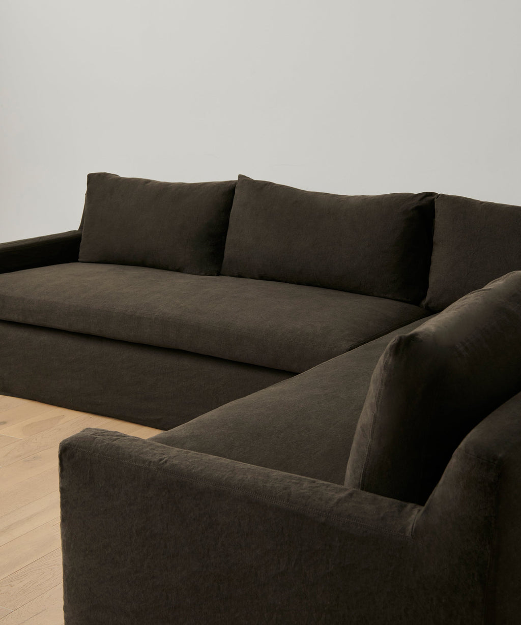 https://cdn.shopify.com/s/files/1/0565/1234/8333/files/upholstered-linen-harbor-sectional-jet-linen-3.jpg?v=1687897105