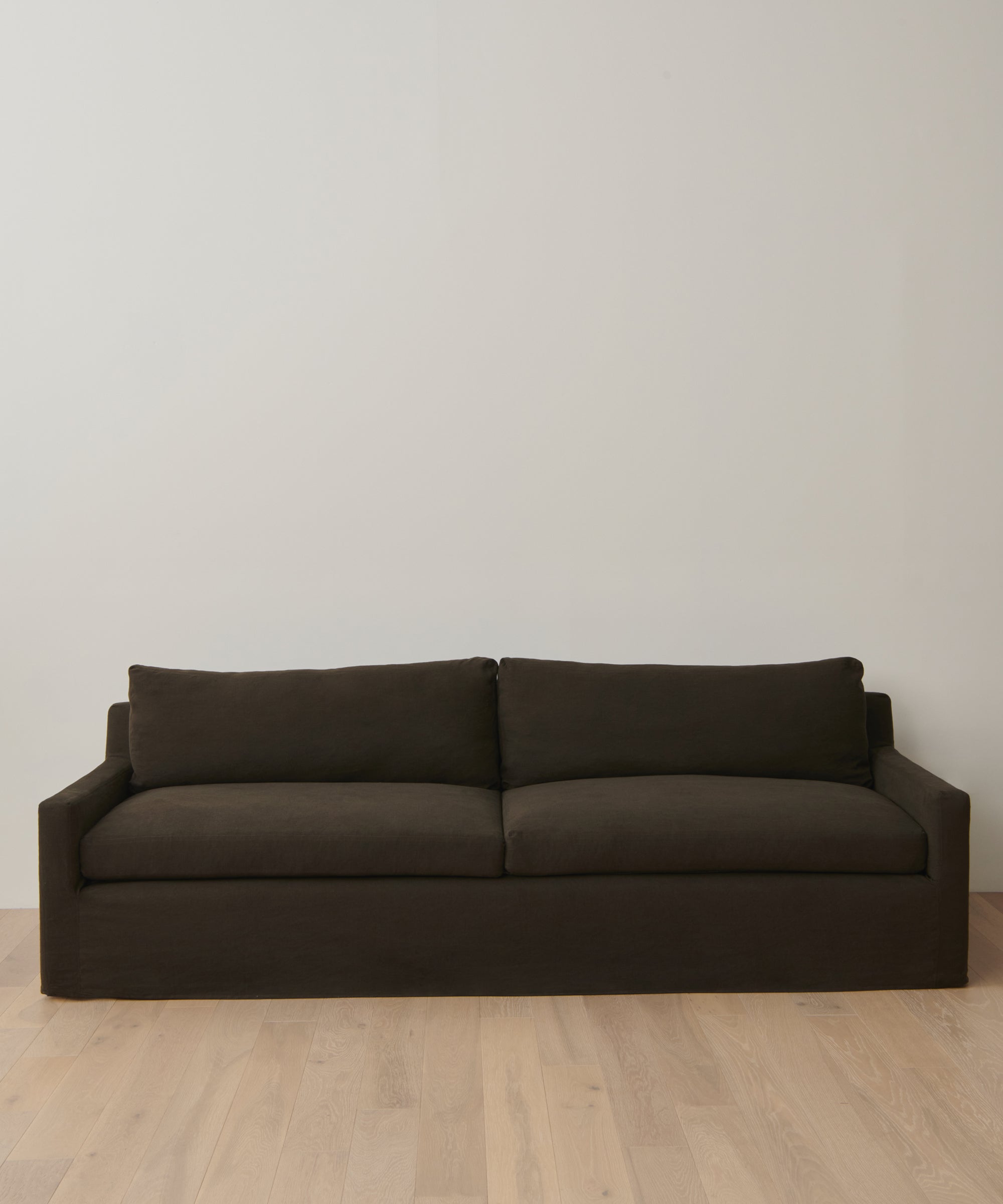 https://cdn.shopify.com/s/files/1/0565/1234/8333/files/upholstered-linen-harbor-sofa-jet-linen-1.jpg?v=1762182732