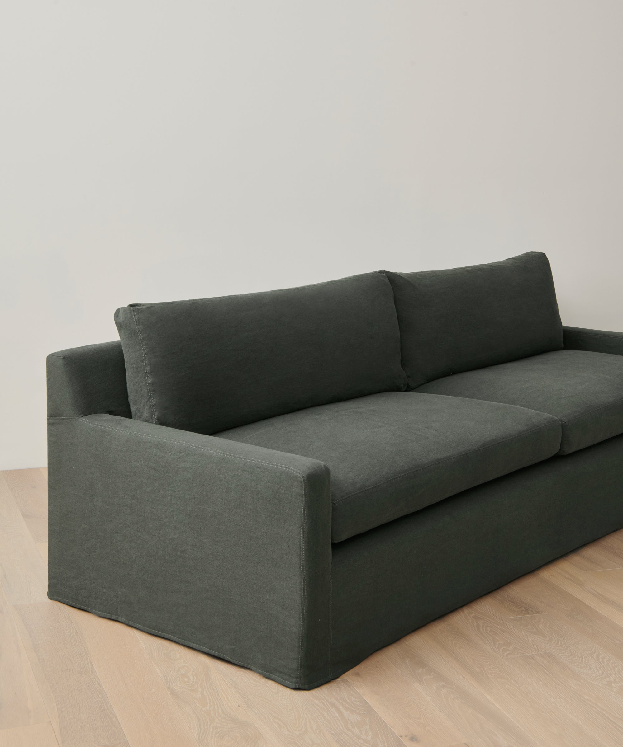 https://cdn.shopify.com/s/files/1/0565/1234/8333/files/upholstered-linen-harbor-sofa-slate-linen-02.jpg?v=1687992096