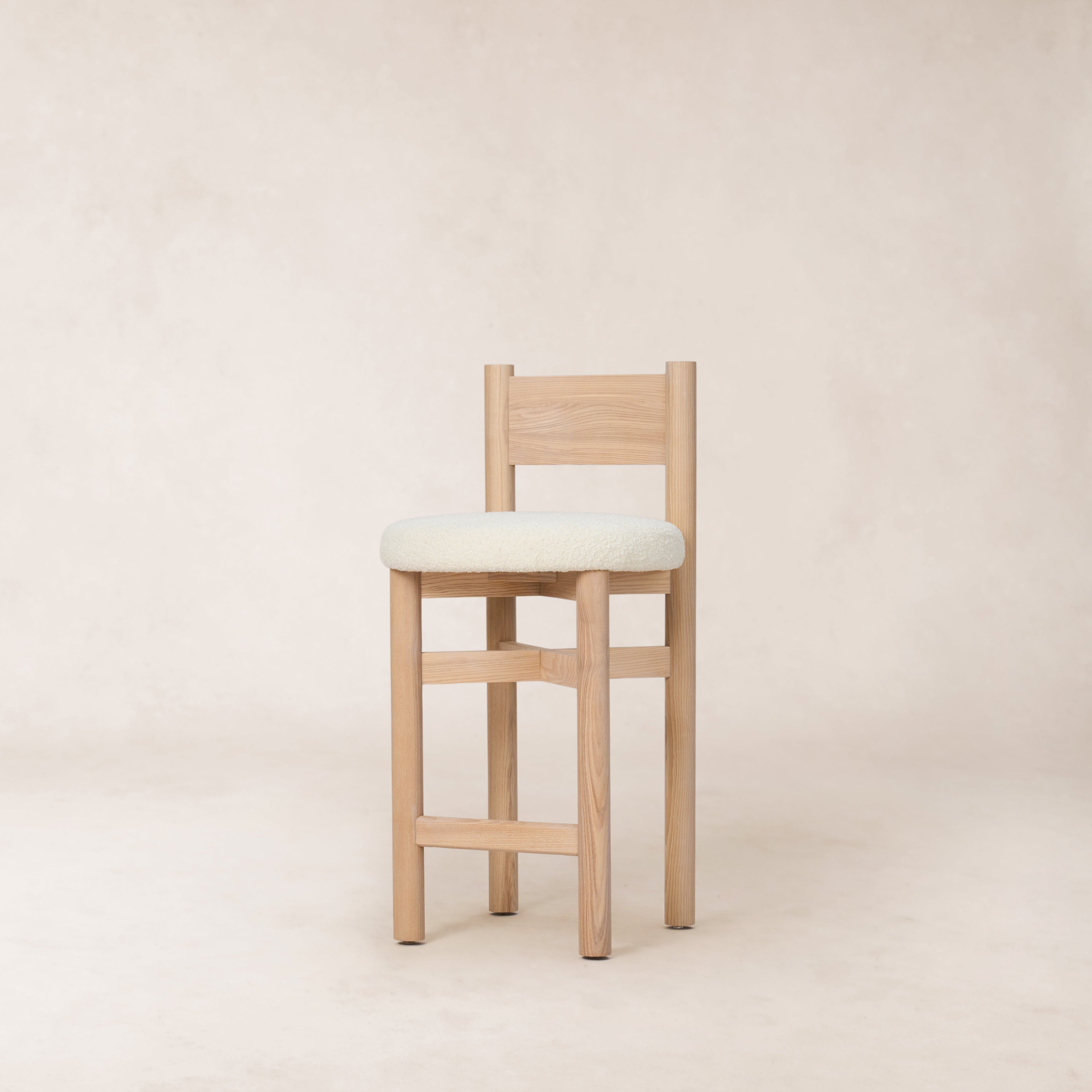 https://cdn.shopify.com/s/files/1/0593/2217/1565/files/white-oak-boucle-counter-stool-good-quality.jpg?v=1765133970