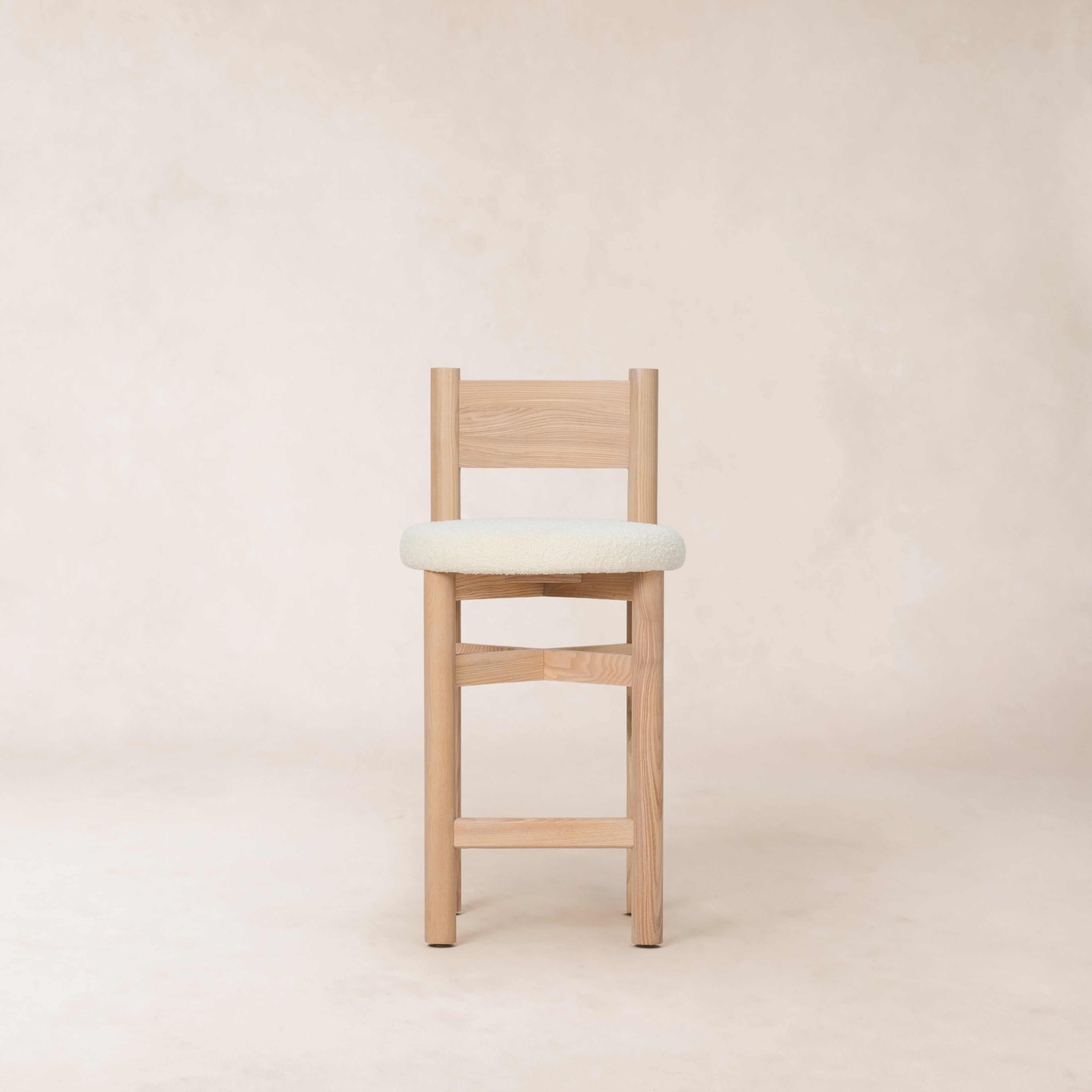 https://cdn.shopify.com/s/files/1/0593/2217/1565/files/white-oak-boucle-counter-stool.jpg?v=1765133970